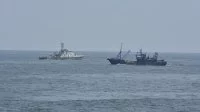 Le patrouilleur congolais P201 et un bateau de pêche
