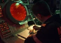 Devant l'écran du sonar